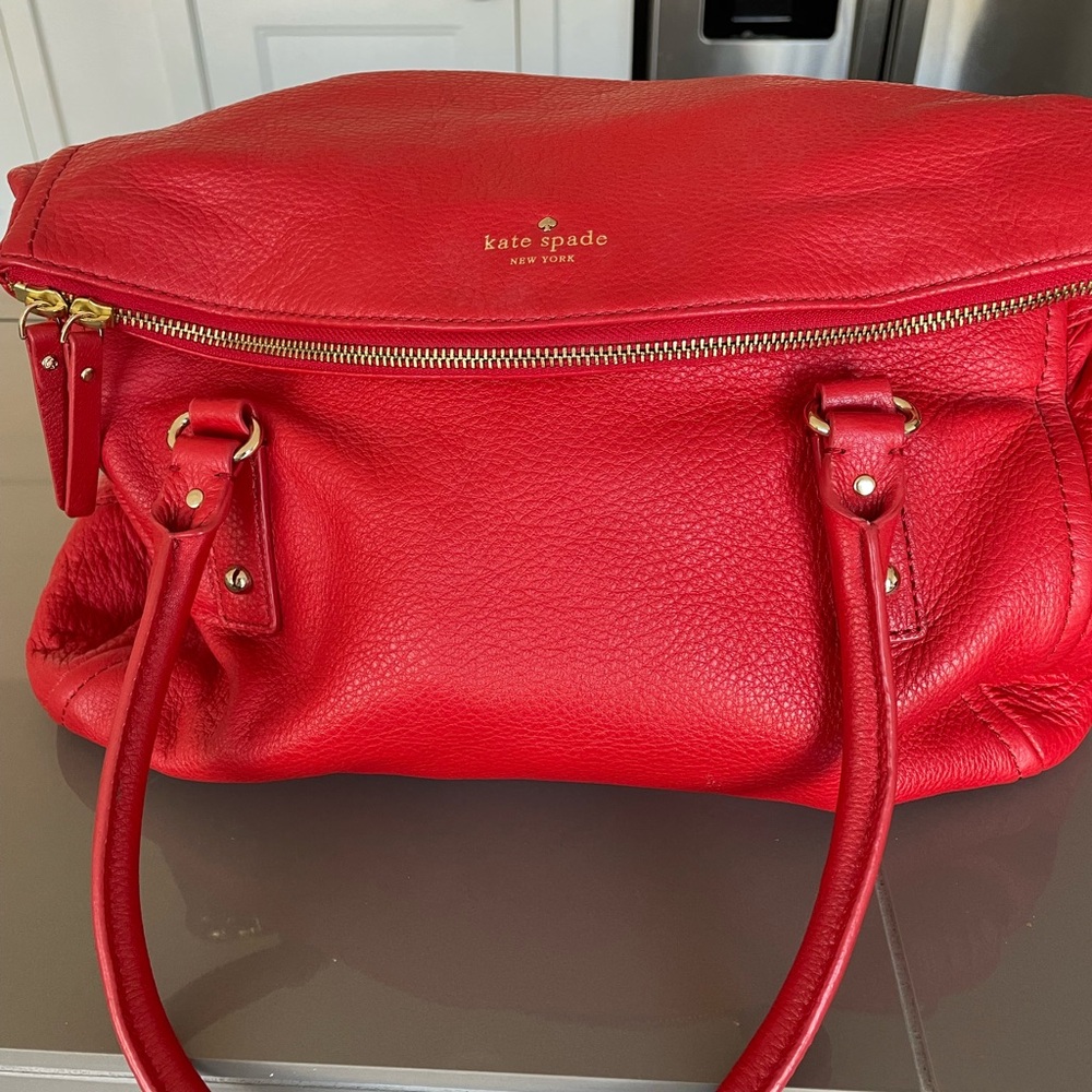 Kate Spade red leather handbag.